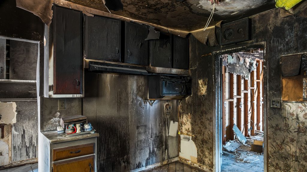 kitchen with damage after a house fire