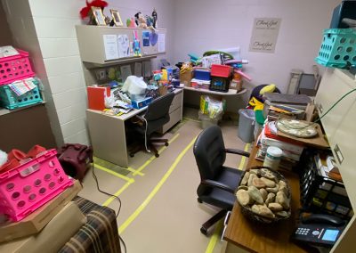 stacked furniture in office after tear out at Saint Stephens Church in Omaha, NE